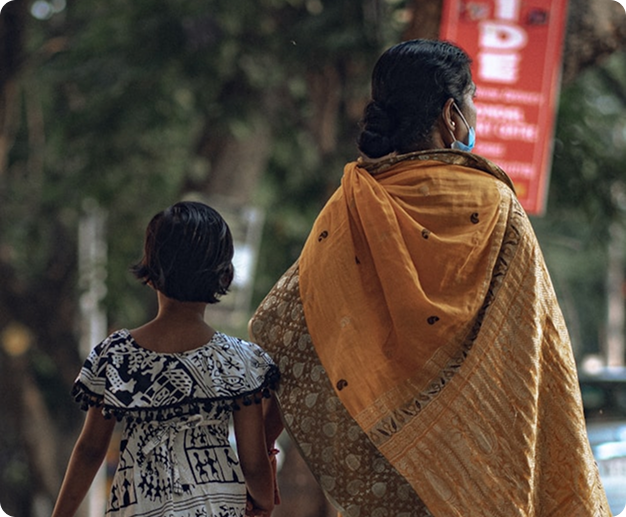 Two people walking, symbolizing care and support